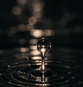 A drop hitting still water